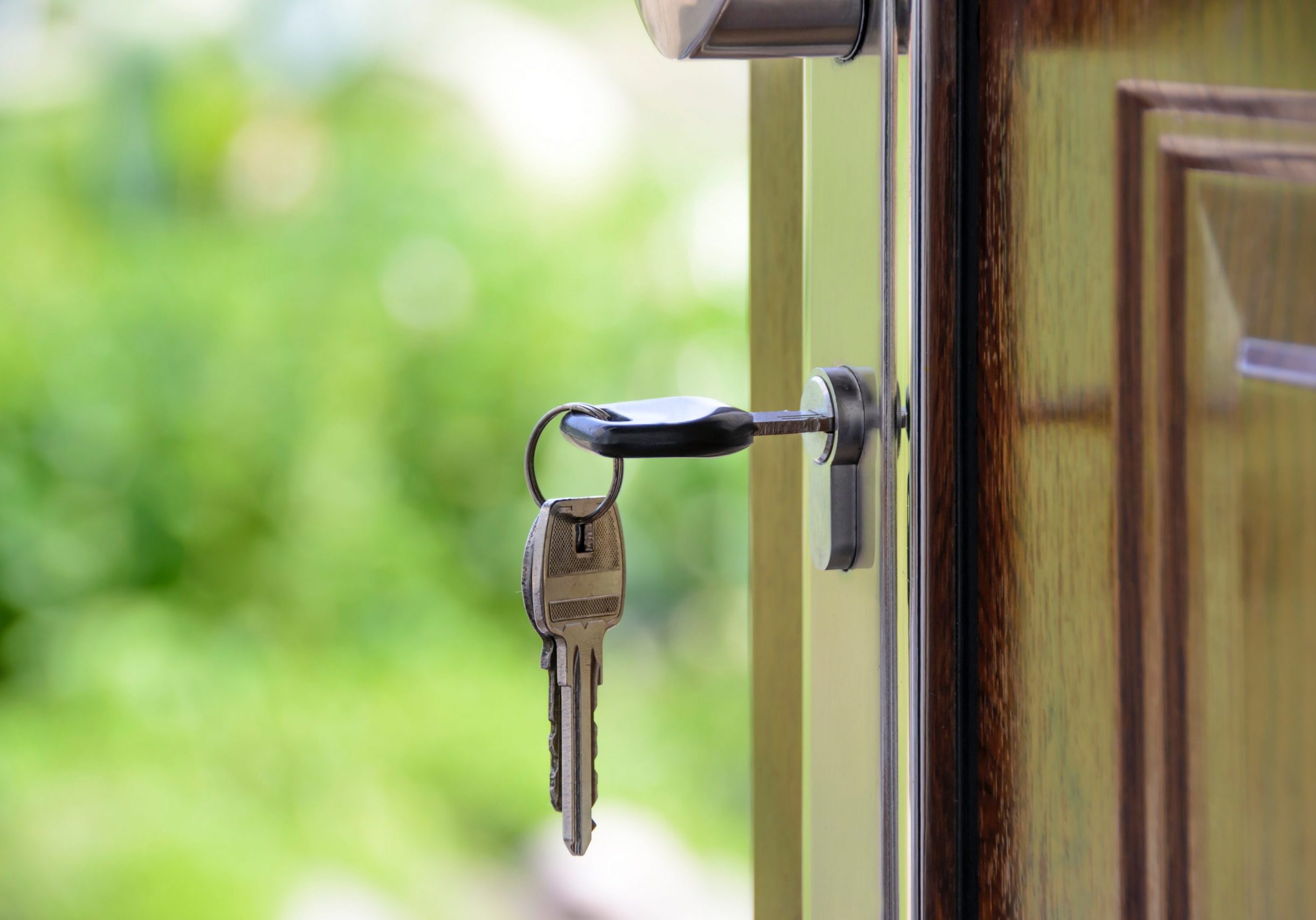 Keys in door stock photo